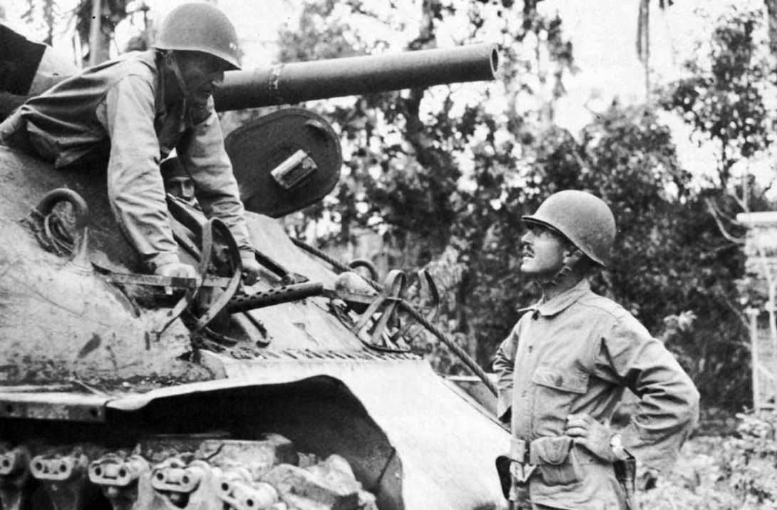 Major General Verne Mudge (in tank) confers with Brig. Gen. William C. Chase.
